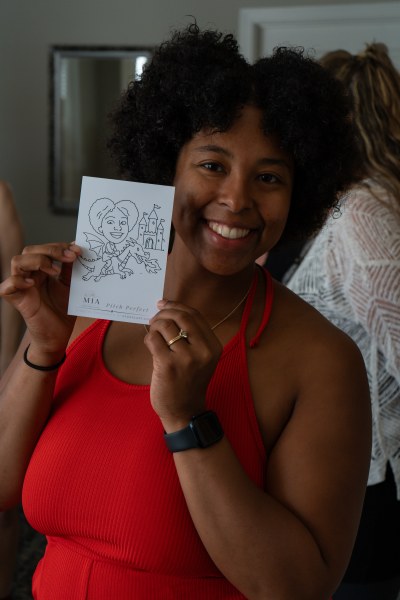 Guest holding their finished robotic caricature print